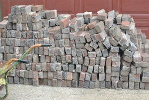 Aproximately 1400 bricks waiting to become a pathway in the Secret Garden.