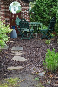 This little side garden needs help.  That's the giant false indigo in the lower right.  When it reaches its full power during the summer, it blocks the path.  I wonder what brilliant gardening mind thought that wouldn't happen????